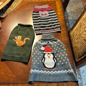 3 pet sweaters . 2 small and one medium. All bought for a small 12lb dog